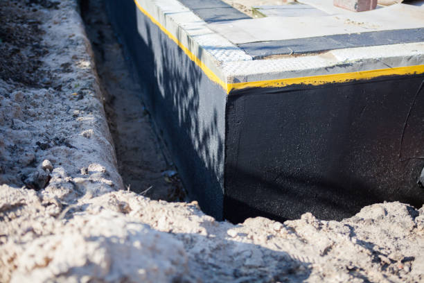 Professional Basement Waterproofing technician working in Jacksons Gap, AL